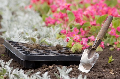 Close-up of gardening tools and gloves on a wooden bench in an urban garden